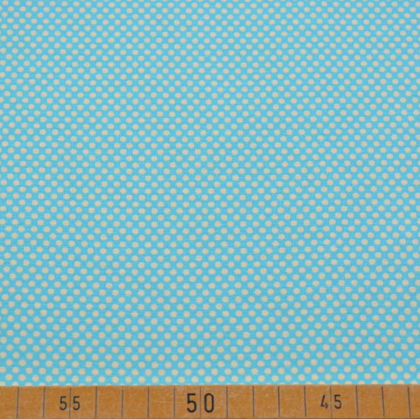 Entzückender Baumwoll Jersey mit einem modernen Punktemuster auf einem türkisfarbenen Untergrund. Ideal für T-Shirts, Kleider und Accessoires. 95% Baumwolle, 5% Elasthan, 200 g/m², 150 cm breit. Perfekt für kreative Nähprojekte.